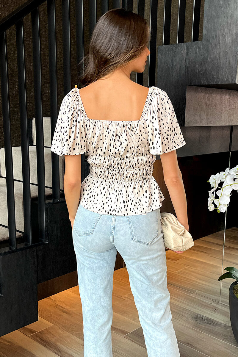 Cream And Black Spot Printed Flutter Sleeve Shirred Waist Top